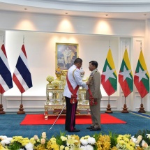 Senior General Maha Thray Sithu Min Aung Hlaing accepts the Knight Grand Cross (First Class) of the Most Exalted Order of the White Elephant presented by Thai King